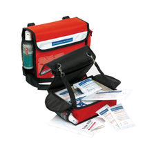 Befüllte Verbandtasche für den Kindergarten von Holthaus Medical, orange-schwarz, mit Schultergurt