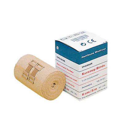Aufgerollte beige Kurzzugbinde mit zwei Klammern zur Befestigung, medizinische Bandage