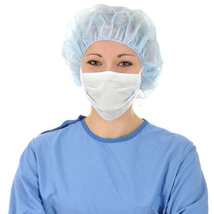 Doctor wearing a surgical cap, mask, and gown