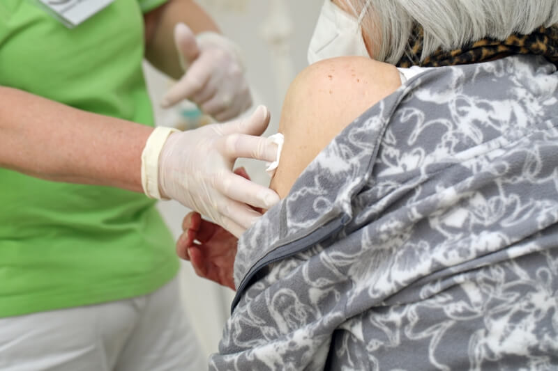 A doctor dabs a patient's wound - buy dressing materials now!
